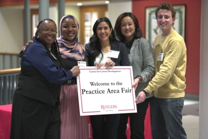 Jing Kong, second from right, volunteered to help law students for a Center for Career Development event.
