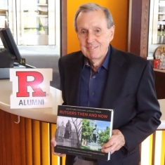 James W. Hughes with his book Rutgers Then and Now